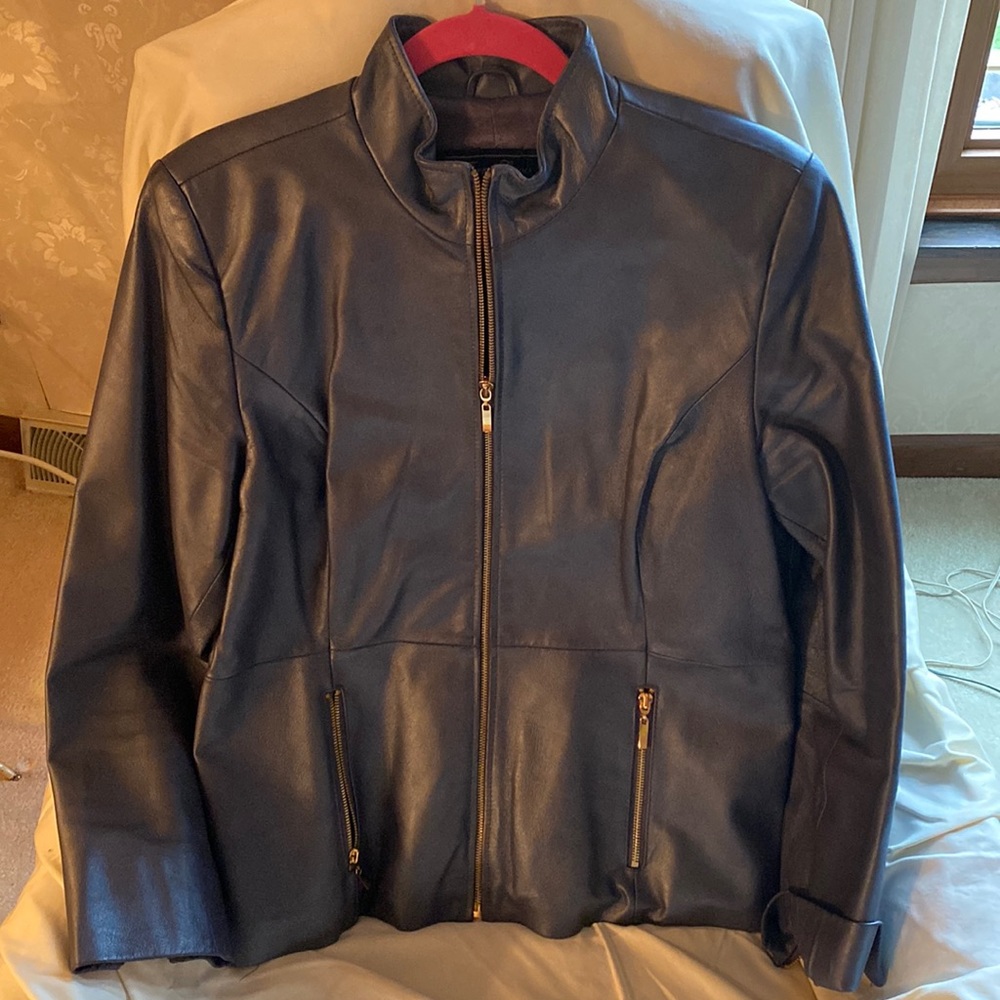 Terry Lewis womens grey leather jacket with gold hardware. Size medium.
